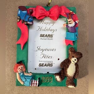 1999 Sears Portrait Studios Christmas Toys 3D Sculpted Photo Ornament. 4” by 3”